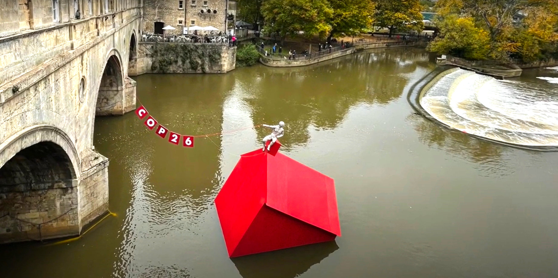 Sinking House sculpture by Anna Gillespie as viewed from the the terrace overlooking the weir